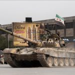 Civilians flee Aleppo as fighting erupts between Syrian army and SDF